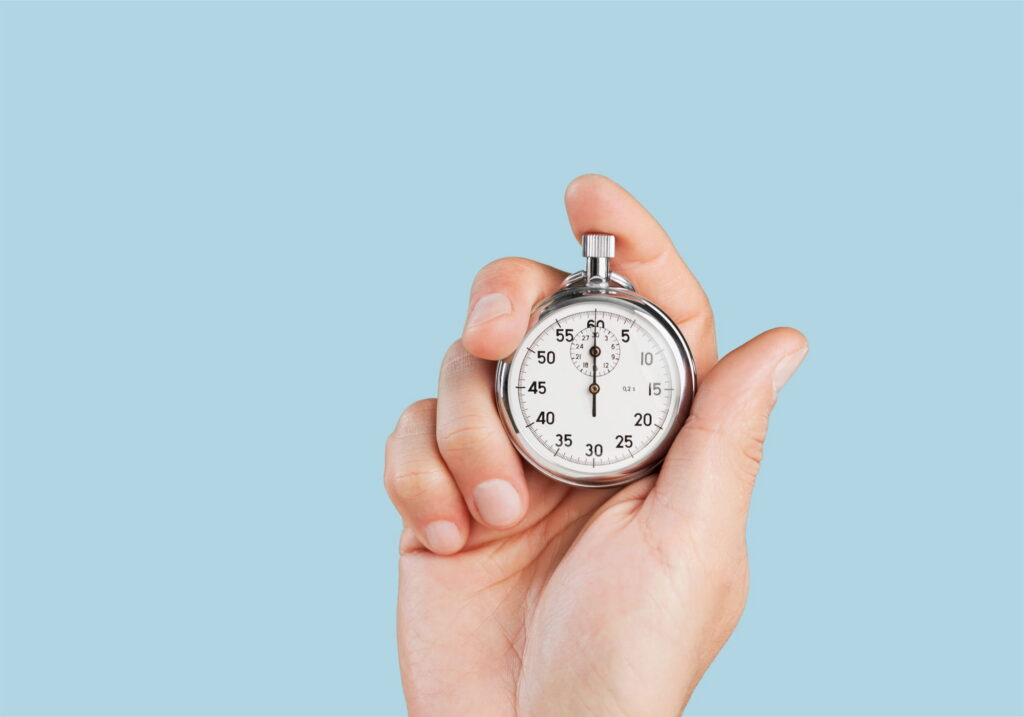 A person holding a stopwatch. Time is money.